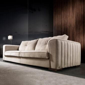 Distinguished DV Home Collection Beverly sofa with light beige textile upholstery and refined vertical quilting