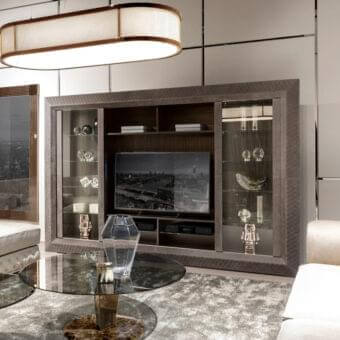 Elegant DV Home Collection Byron TV cabinet in matt Ebano Macassar veneer with quilted leather accents and tempered glass doors