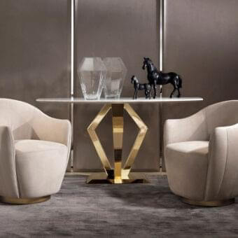 Distinguished DV Home Collection Deco console with stainless steel base and refined marble top showcasing geometric gold finish