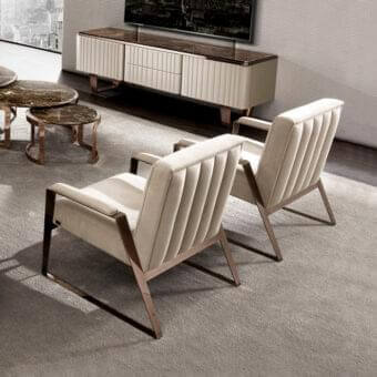 Exceptional DV Home Collection Deco lounge chair with light beige fabric upholstery and copper finished steel structure