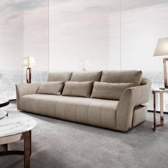 Exclusive DV Home Collection Deco sofa upholstered in smooth matte beige textile with rose gold steel accents and refined stitching