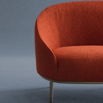 Distinctive Potocco Yoisho sofa with reddish-orange textured textile upholstery and bronzed brass finished ash legs