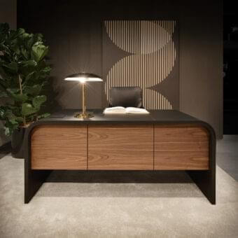 Innovative 4 Mariani Nami desk with curved saddle leather and dark top, built with wood-paneled drawers and hidden wireless charging