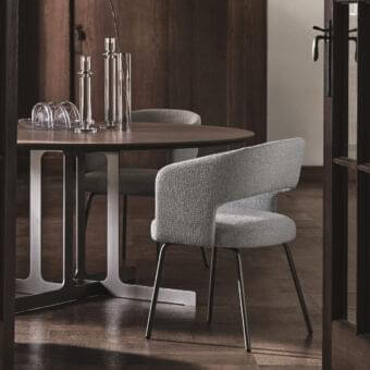 Elegant Ditre Italia 356 armchair with a textured gray textile shell and varnished metal legs