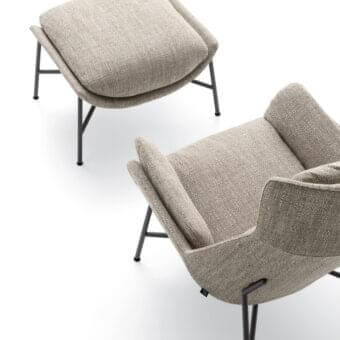 Superior Ditre Italia Beetle lounge chair with footrest in textured light beige fabric and slender dark metal legs