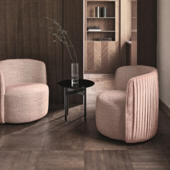 Elegant Ditre Italia Chloè lounge chair in light pink woven textile with pleated back and dark slender legs