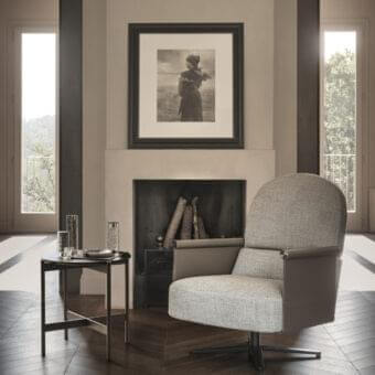 Sophisticated Ditre Italia Beyl lounge chair with light gray textile upholstery and warm gray leather armrests built with a painted metal base