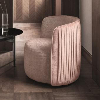 Sophisticated Ditre Italia Chloè lounge chair upholstered in muted mauve textile with vertical pleating on the backrest