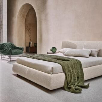 Elegant Ditre Italia Claire bed with woven light beige fabric upholstery and wraparound headboard