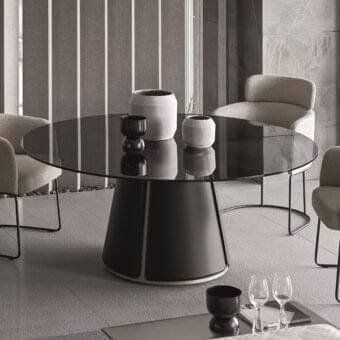 Distinguished Ditre Italia Claire table with circular clear glass and conical recycled bonded leather base in matte dark gray