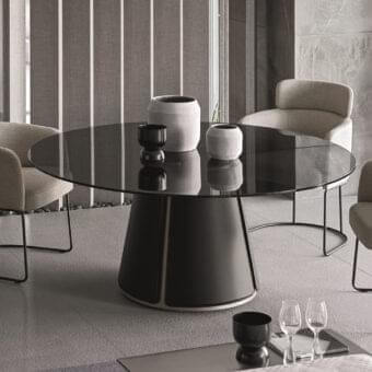 Distinguished Ditre Italia Claire table with circular glass top and dark matte recycled bonded leather base