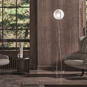 Harmonious Ditre Italia Cut Soft lounge chair upholstered in textured gray textile with a dark metal swivel base