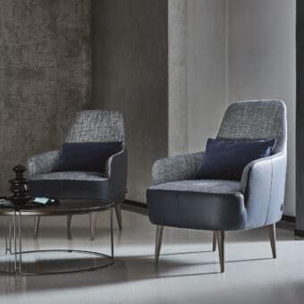 Distinguished Ditre Italia Ray lounge chair with textured gray textile and smooth matte synthetic material sections, supported by natural wood legs