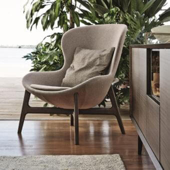 Distinguished Ditre Italia Round Lounge Chair with wraparound shape and dark-stained wooden base in light taupe fabric with matte finish
