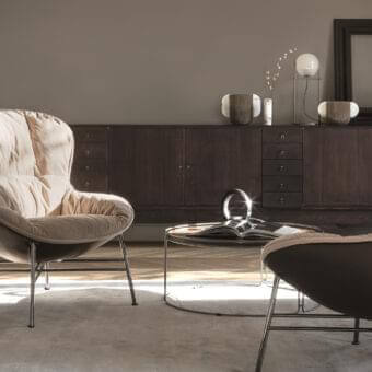 Innovative Ditre Italia Softy lounge chair with light beige textile and darker brown leather shell supported by satin-finish metal base