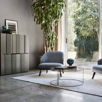 Sophisticated Ditre Italia St Tropez lounge chair with curved backrest upholstered in blue textile and tan accents built on a solid wood base