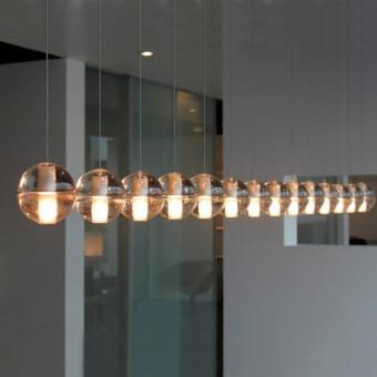 Exceptional Bocci 14 Linear Suspension Lamp with articulated cast glass spheres and glossy clear glass finish