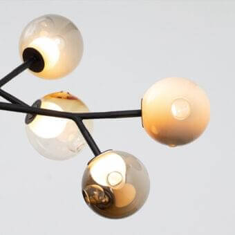 Superior Bocci 28 Armature ceiling lamp with a soft-touch matt black steel armature and gradient glass shades in clear, amber, smoky gray tones