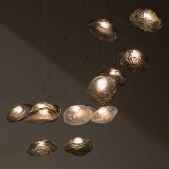 Captivating Bocci 73 suspension lamp crafted in blown glass with braided metal cable and brushed nickel canopy exhibiting a warm golden-bronze tone