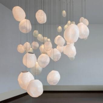 Captivating Bocci 73V suspension lamp crafted in ivory glass with a subtly wrinkled, diffused light finish