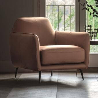 Harmonious Ditre Italia Ellie lounge chair with smooth light brown upholstery and dark metal pressure die-cast feet