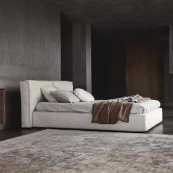 Distinguished Ditre Italia Flann bed crafted in Italy with light grey textile upholstery and padded headboard