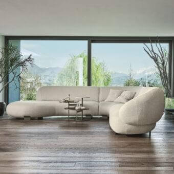 Elegant Ditre Italia Pacific sectional with organic form and sinuous lines in light beige textured fabric