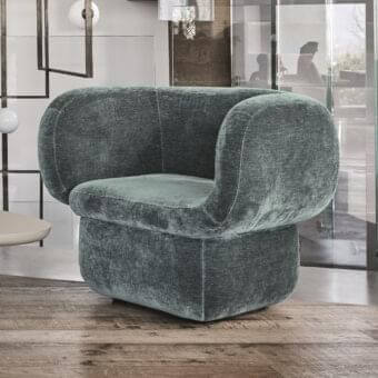 Distinguished Ditre Italia Vento lounge chair with muted green-gray textile and curved lines crafted in Italy with a matte finish