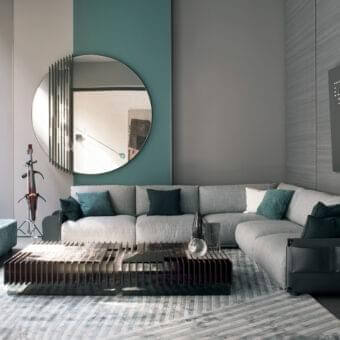 Exceptional Giorgetti Adam sectional with light gray fabric, dark teal cushions and a pewter painted metal structure crafted with leather detailing