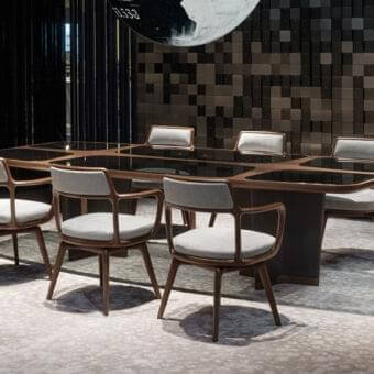 Elegant Giorgetti Bigwig table with shaped Canaletto walnut, tempered glass inserts and leather-covered star legs in glossy and matte finish