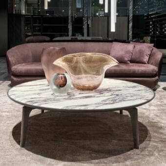 Elegant Giorgetti Blend coffee table with circular marble top and tapered ash wood legs in satin finish