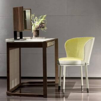 Elegant Giorgetti Ode chair with a vivacious rotating structure in light chartreuse and white textiles with a light-toned wood frame and metal feet