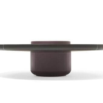Innovative Giorgetti Ray coffee table with a round silhouette and muted purplish-brown leather storage structure supporting a solid ash top