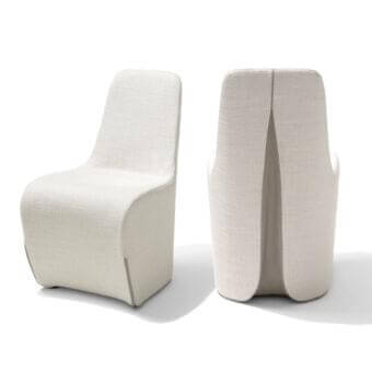 Distinguished Giorgetti Tie chair with full volume, haute couture-inspired slit back and refined off-white textured fabric upholstery with leather detail
