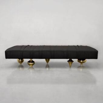 Exquisite Il Pezzo Mancante Il Pezzo 1 bench upholstered in black leather with vertical pleating and sculpted sand brass legs