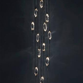 Exclusive Il Pezzo Mancante Il Pezzo 12 suspension lamp crafted in clear crystal with sleek brass stems and glossy dark finish