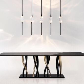 Distinguished Il Pezzo Mancante Il Pezzo 12 suspension lamp with a female figure carrying light within clearest crystal and refined dark brass stems