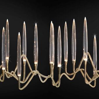 Distinguished Il Pezzo Mancante chandelier crafted in hand-forged brass with clear solid crystal elements and polished gold finish
