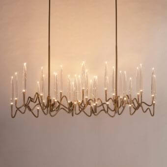 Superior Il Pezzo Mancante Il Pezzo 3 chandelier crafted in hand-forged brass with a satin gold finish and clear solid crystal illumination
