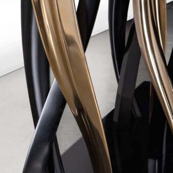 Distinguished Il Pezzo 8 table with sculptural intertwined elements in glossy black and bronze with black and gold finishes