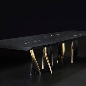 Sophisticated Il Pezzo 8 table crafted with black stained oak and lustrous gold finish inlays supporting aluminum casting legs