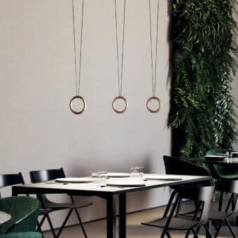 Elegant Lodes IVY V suspension lamp with a thin copper-colored metal ring and delicate black cord in a smooth matte finish