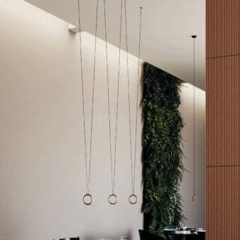 Elegant Lodes IVY V suspension lamp crafted in copper or bronze with a smooth metallic finish and slender dark cables