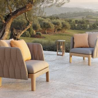 Sophisticated Royal Botania Calypso lounge chair with quilted light grey textile and stainless steel, built with a light matte teak base