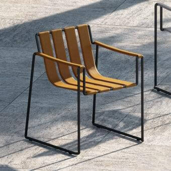 Distinguished Royal Botania Strappy armchair with tan seating straps and matte black coated stainless steel frame