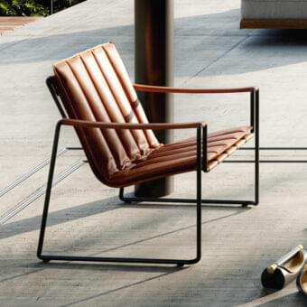 Captivating Royal Botania Strappy lounge chair with coated stainless steel and brown eco-leather straps in a matte black finish