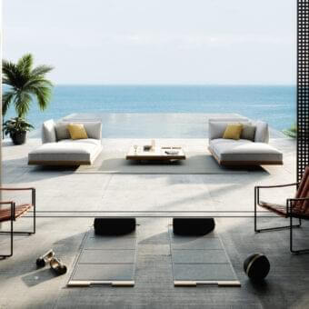 Elegant Royal Botania Strappy lounge chair with matte black coated stainless steel and medium brown eco-leather straps
