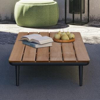 Distinguished Royal Botania Styletto lounge coffee table with sustainable teak wood and dark finished metal base