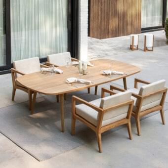 Exceptional Royal Botania Styletto table with cylindrical teak wood legs and smooth teak wood tabletop exhibiting rounded corners