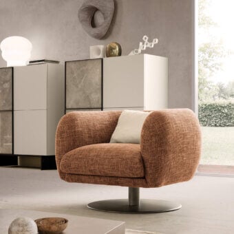 Luxury Presotto Bali lounge chair with warm brown textured textile upholstery and Peltro painted base